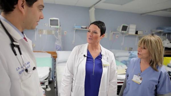 Medical staff talking in medical setting.